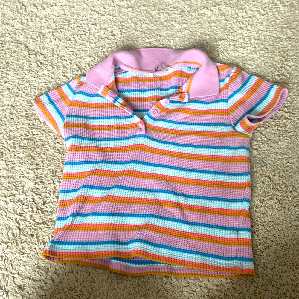 This is a multi colored T-shirt from khols